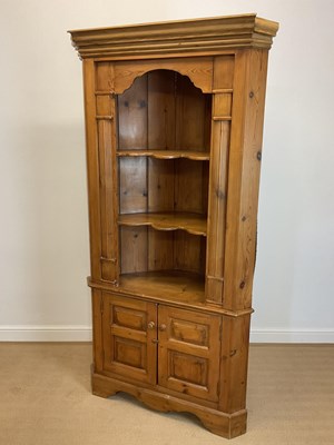 Lot 855 - A pine corner floor standing corner cupboard...