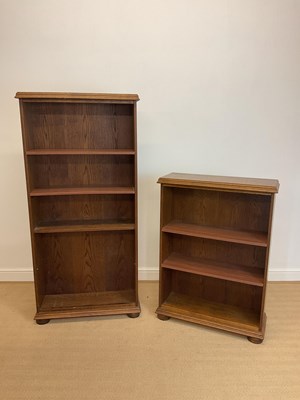 Lot 864 - A small pine book case with two shelves and a...