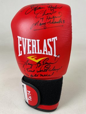 Lot 1968 - An Everlast boxing glove bearing two...