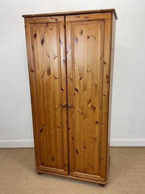 Lot 875 - A pine double wardrobe, height 176cm, width...