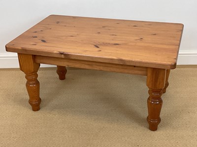 Lot 859 - A rectangular pine coffee table on turned legs,...