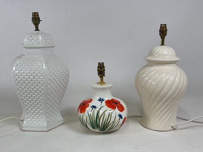 Lot 722 - Three decorative ceramic lamp bases, one...