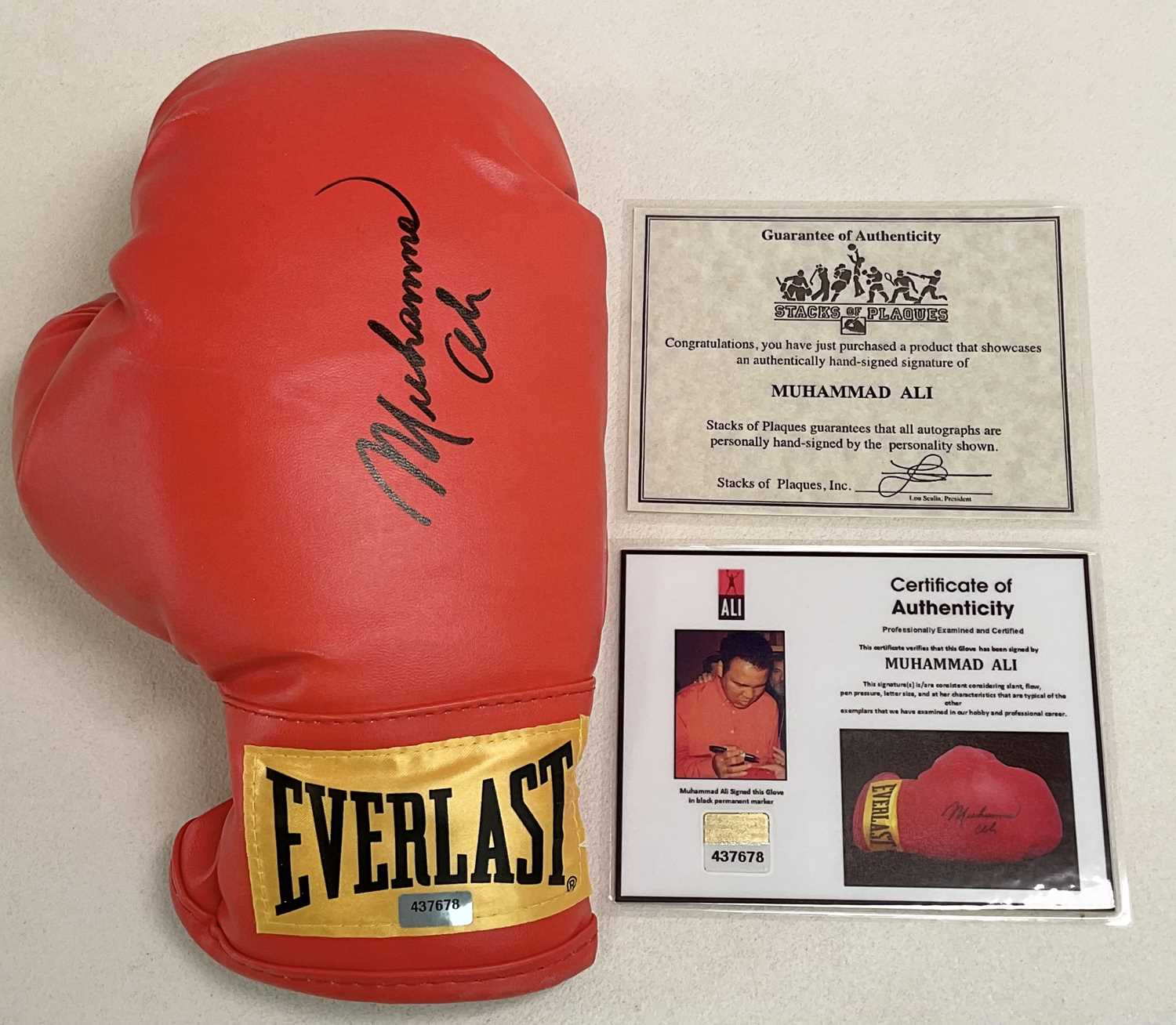 Lot 1942 - MUHAMMAD ALI; a signed single boxing glove,...