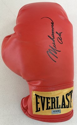 Lot 1942 - MUHAMMAD ALI; a signed single boxing glove,...