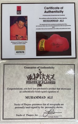 Lot 1942 - MUHAMMAD ALI; a signed single boxing glove,...