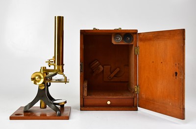 Lot 147 - A brass and lacquered monocular microscope in...