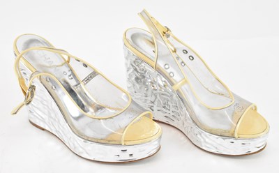 Lot 555 - CHANEL; a pair of CC logo clear metallic...