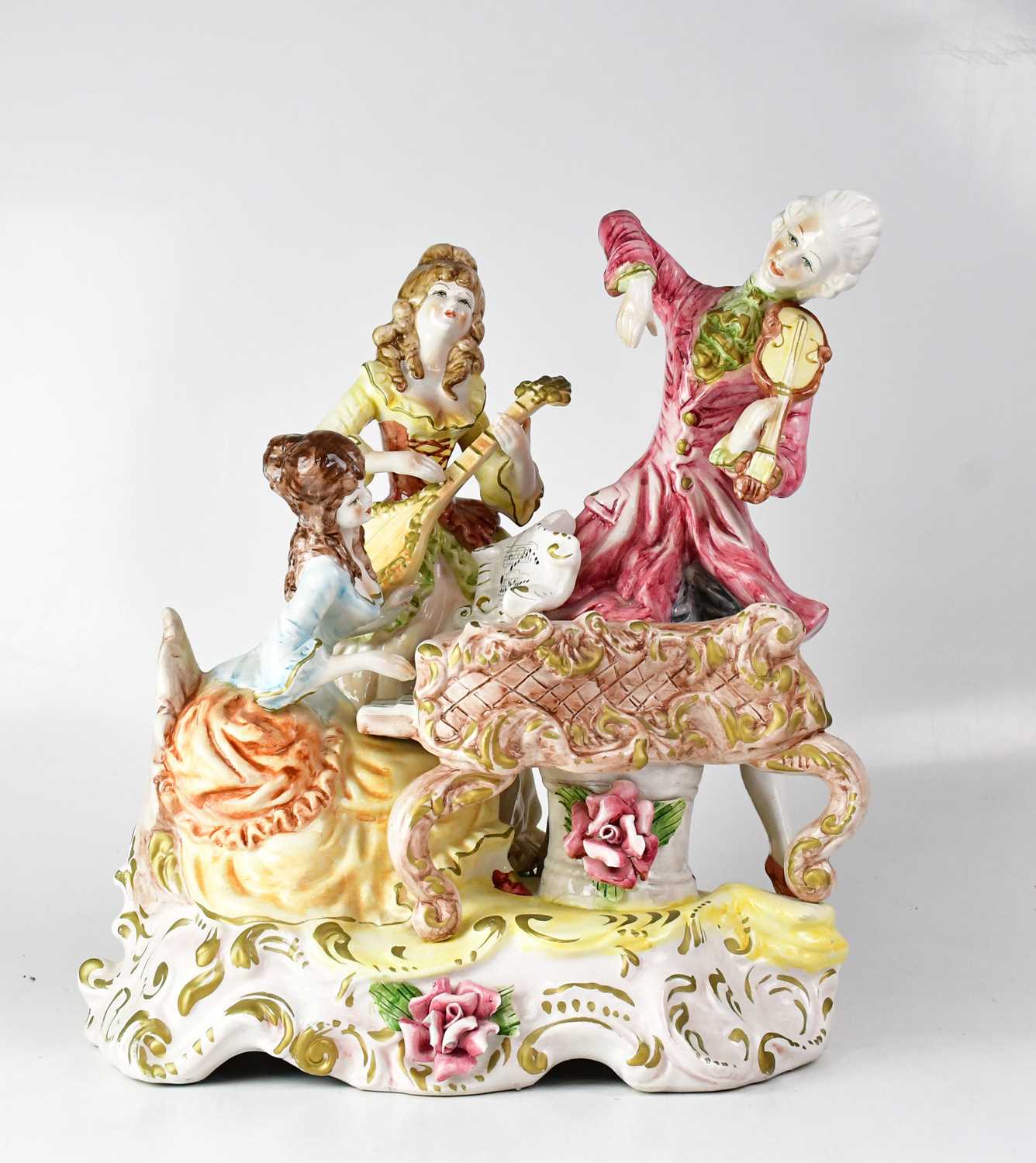 Lot 456 - CAPODIMONTE; a large figure group of three...