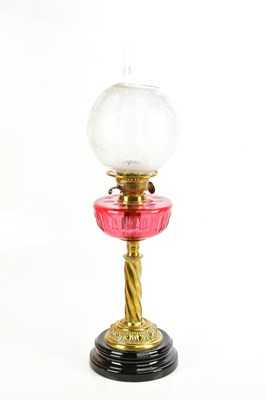 Lot 621 - A Victorian brass oil lamp, with frosted glass...