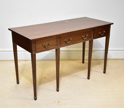 Lot 72 - A reproduction mahogany side table with three...