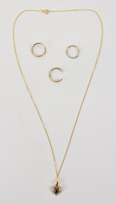 Lot 1326 - A 9ct yellow gold necklace suspending a yellow...