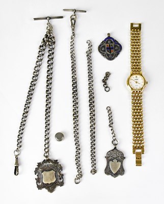 Lot 665 - Two silver curb watch chains, each with a...