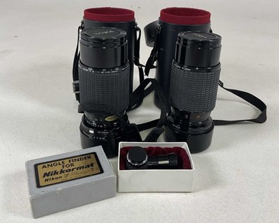 Lot 324 - A Leica lens and Nikon Sigma lens, both cased,...