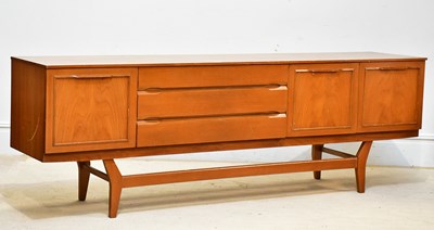 Lot 21 - A mid century teak sideboard, with three...