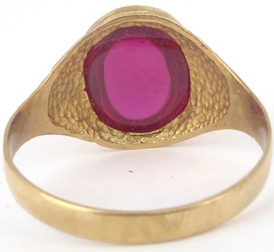 Lot 780 - A vintage 9ct gold ring with oval bezel set...