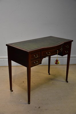 Lot 139 - An Edwardian inlaid mahogany serpentine front...