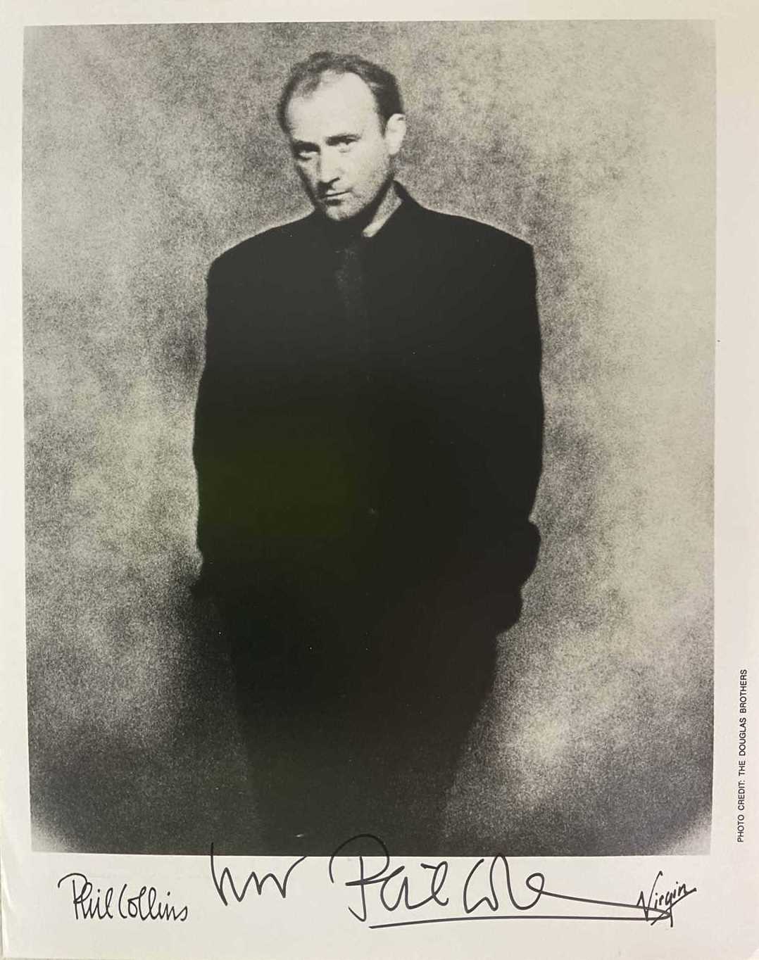 Lot 1759 - PHIL COLLINS; a black and white photo image...