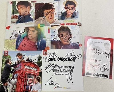 Lot 1624 - ONE DIRECTION; a large A4 sized photo montage...