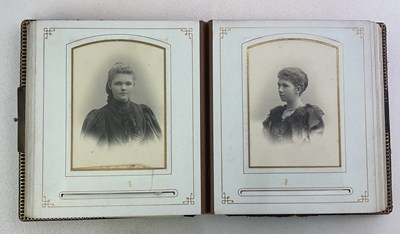 Lot 47 - A Victorian photograph album with twenty-six...