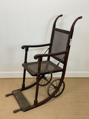 Lot 814 - A vintage folding wheelchair with rattan seat...