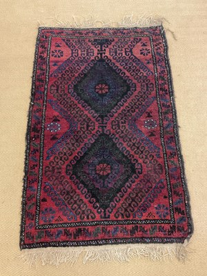 Lot 741 - A Persian handwoven rug with two central...