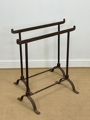 Lot 750 - A pair of wrought iron trestles on splayed...