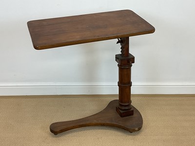 Lot 850 - A mahogany adjustable reading table with...