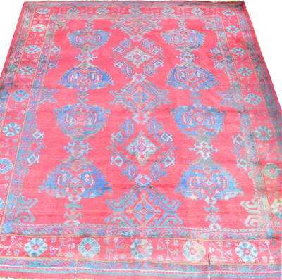 Lot 106 - A red ground wool carpet, 360 x 310cm.