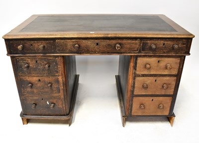 Lot 18 - An Edwardian oak pedestal desk with leather...