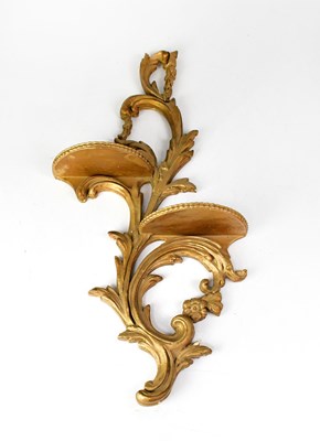 Lot 37 - A Rococo-style gilded wall shelf with foliate...