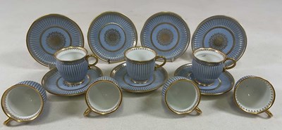 Lot 170 - SÈVRES; a set of seven fluted cabinet cups and...