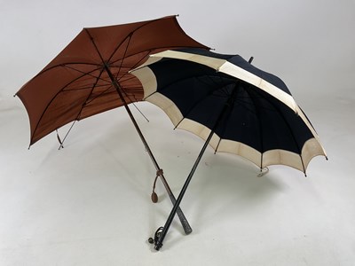 Lot 1516 - A vintage parasol with elaborate white metal...