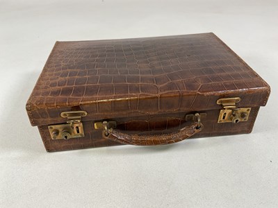 Lot 147 - A vintage crocodile leather travelling case,...