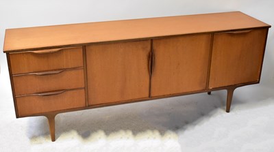 Lot 74 - A mid-20th century teak sideboard with a pair...