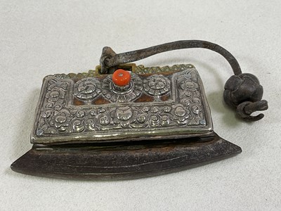 Lot 1492 - A Nepalese white metal brass iron and leather...