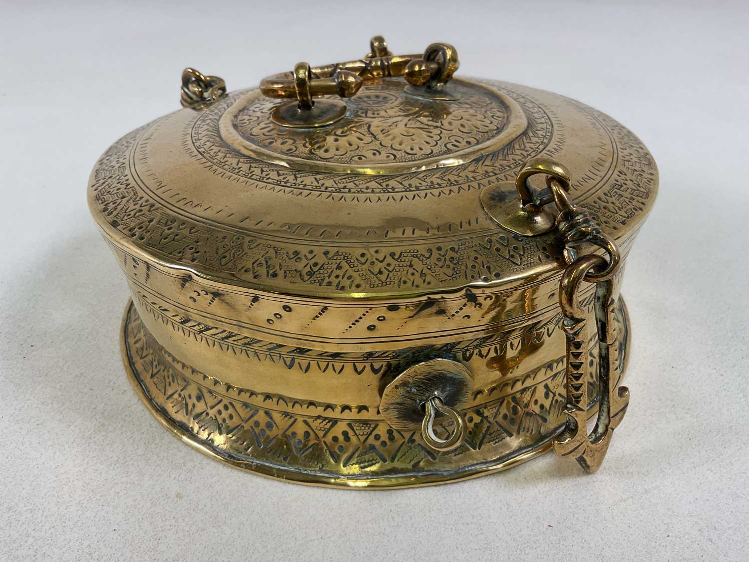 Lot 284 - An Eastern brass engraved incense box, with...