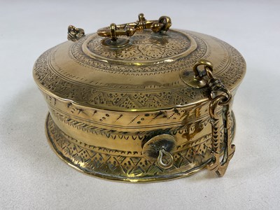 Lot 284 - An Eastern brass engraved incense box, with...