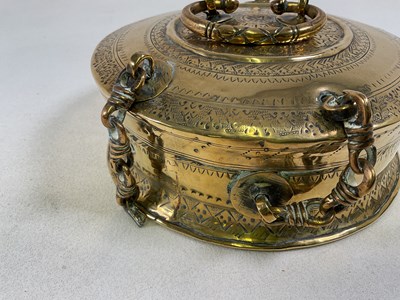 Lot 284 - An Eastern brass engraved incense box, with...