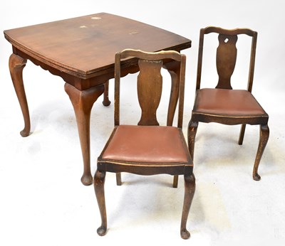 Lot 27 - An early 20th century walnut dining suite...