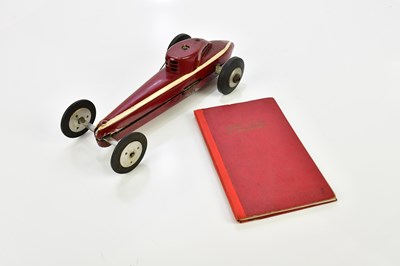 Lot 901 - A petrol engine model race car, with a book...