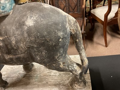 Lot 1014 - A 19th century painted wood sculpture of a boy...