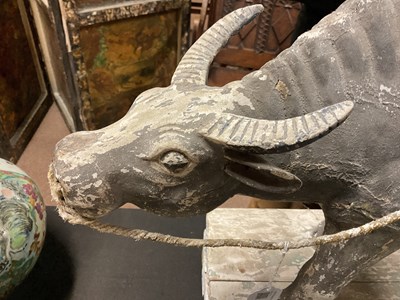 Lot 1014 - A 19th century painted wood sculpture of a boy...