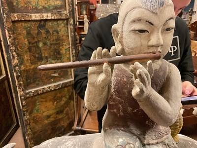 Lot 1014 - A 19th century painted wood sculpture of a boy...