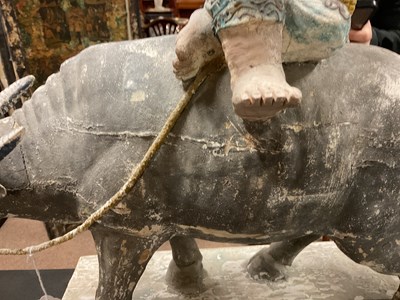 Lot 1014 - A 19th century painted wood sculpture of a boy...