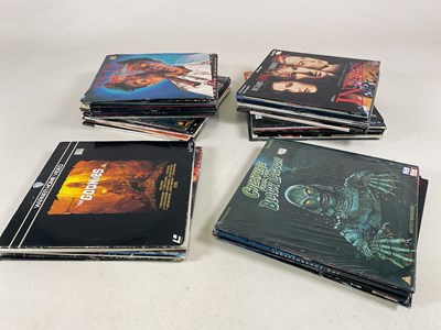 Lot 1867 - A collection of fifty six movie Laser Discs,...