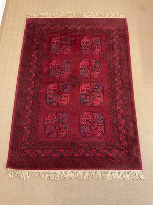 Lot 742 - An Afghan aqcha rug with central medallions...