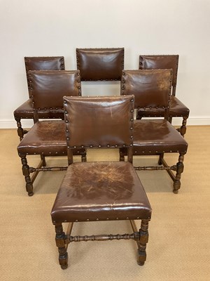 Lot 857 - A set of oak and leather dining chairs,...