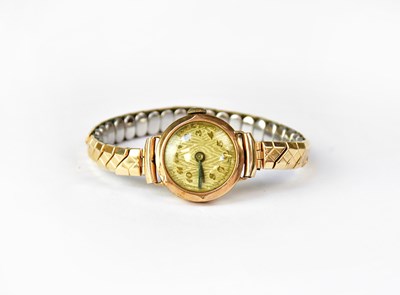 Lot 677 - A 9ct gold wristwatch, the textured dial set...