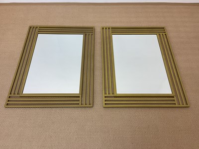 Lot 834 - A pair of modern contemporary wall mirrors...