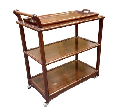 Lot 1014 - A modern Chinese hardwood three tier trolley,...